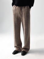 Mayfairloom minimalist wool trousers showing a sleek, tailored fit with a smooth waist and clean lines on a neutral background.