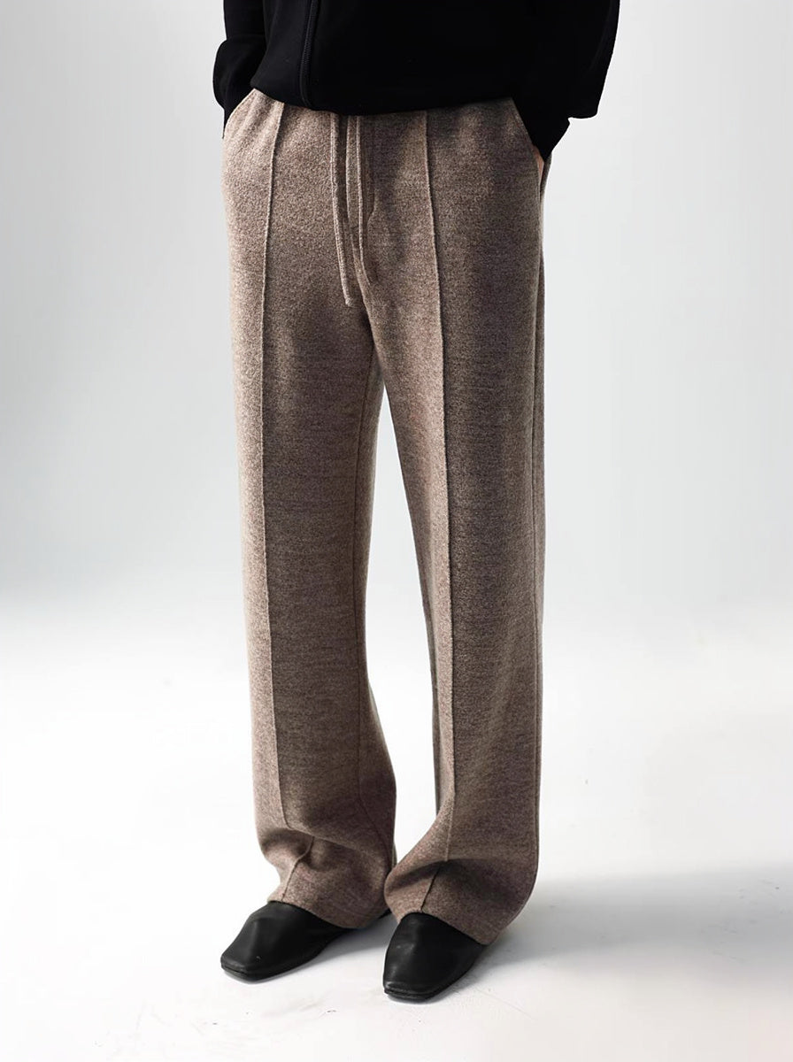 Mayfairloom minimalist wool trousers showing a sleek, tailored fit with a smooth waist and clean lines on a neutral background.