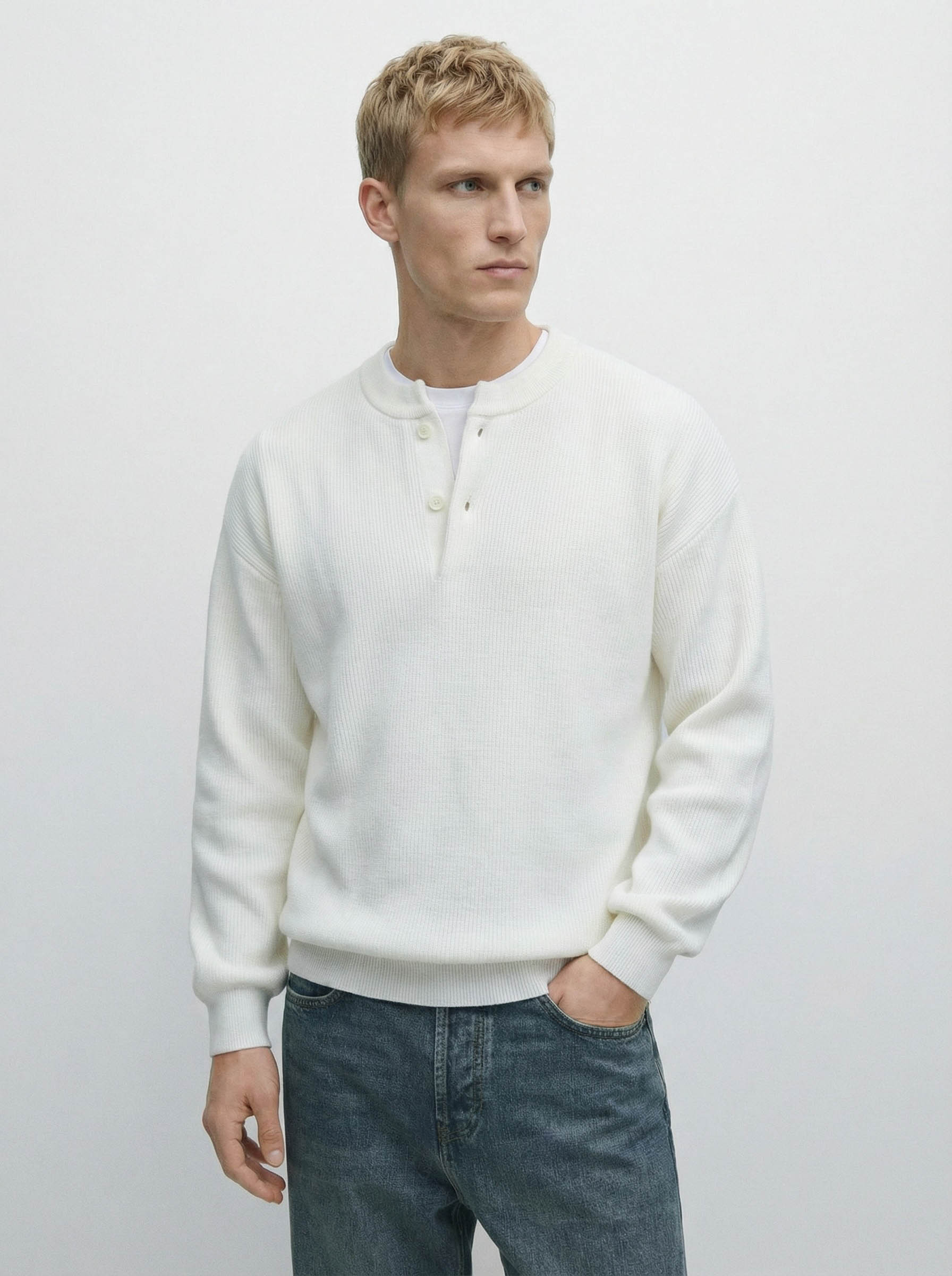White Nomad Knit Henley Sweater by Mayfairloom, featuring a classic knit design and Henley neckline on a plain background.