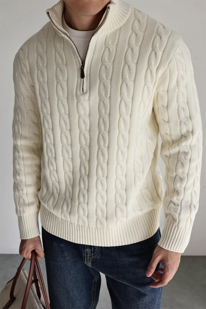 Cable-knit cotton quarter-zip sweater by MayfairLoom featuring a classic old money style, shown in a close-up of the textured fabric.