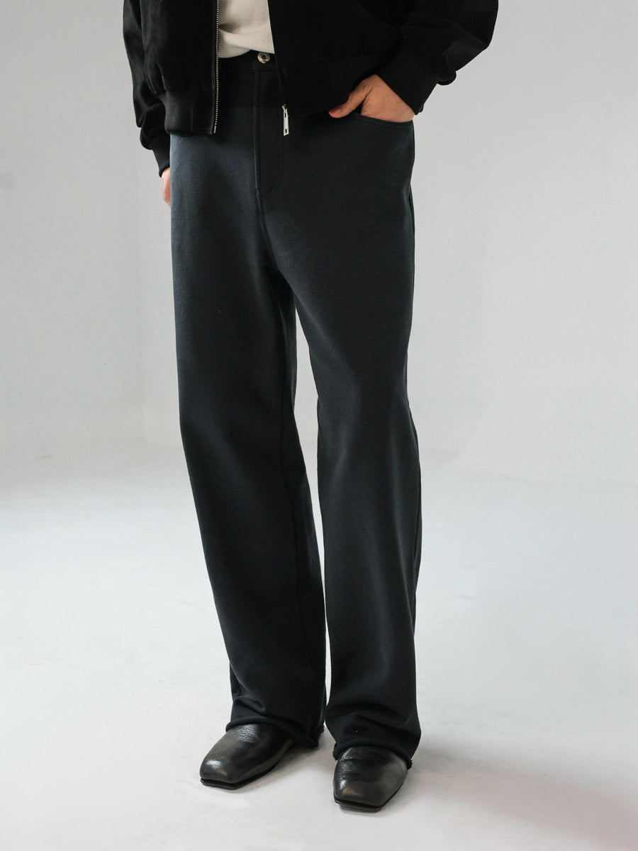 Mayfairloom denim-cut sweatpants made of soft cotton, showing a relaxed fit with visible stitching and side pockets.
