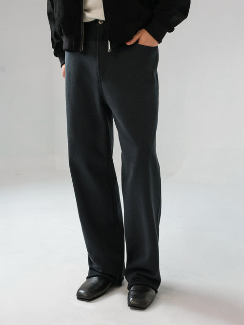 Mayfairloom denim-cut sweatpants made of soft cotton, showing a relaxed fit with visible stitching and side pockets.