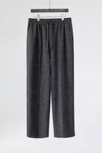 Mayfairloom minimalist wool pants featuring a sleek, tailored fit and neutral color, displayed on a mannequin.