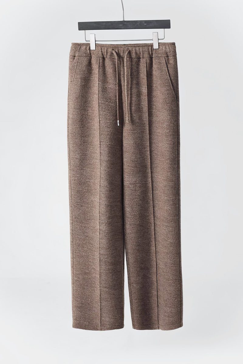 Mayfairloom minimalist wool pants shown on a model, featuring a sleek, effortless design with clean lines and a tailored fit.
