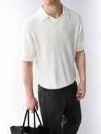 Mayfairloom Gullwing V-Neck Knit Polo, close-up of navy blue knit fabric and V-neck design on a casual men's polo shirt
