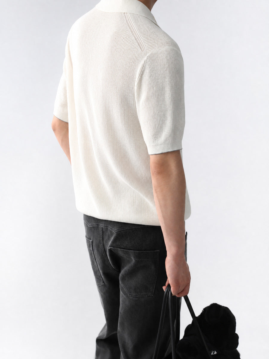 Mayfairloom Gullwing V-Neck Knit Polo shirt displayed on a hanger, featuring a classic V-neck design and fine knit fabric.