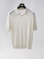 Mayfairloom Gullwing V-Neck Knit Polo shirt displayed on a hanger, featuring a classic V-neck and ribbed collar in neutral tones.