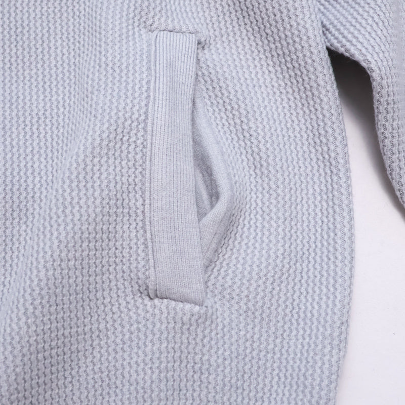 Light grey Marlow cardigan by mayfairloom, featuring a soft knit fabric and classic button-up design, displayed on a hanger.
