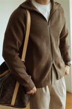 Mayfairloom modal high-neck knit cardigan hanging on a wooden hanger, close-up view of soft fabric and ribbed collar.