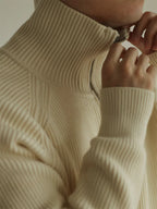 Mayfairloom modal high-neck knit cardigan draped on a hanger, showcasing its soft fabric and stylish high-neck design.