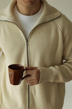 Mayfairloom modal high-neck knit cardigan displayed on a mannequin, featuring a cozy, stylish design with long sleeves and ribbed cuffs.