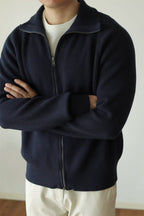 Mayfairloom modal high-neck knit cardigan displayed on a hanger, featuring a soft, cozy fabric and a stylish high neckline.