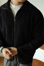 Mayfairloom modal high-neck knit cardigan displayed on a hanger, showcasing its soft fabric and stylish design.