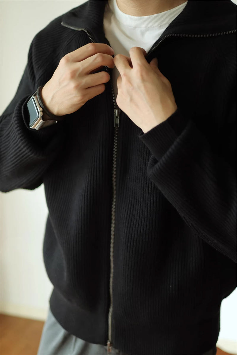 Mayfairloom modal high-neck knit cardigan hanging on a wooden hanger, showcasing its soft fabric and stylish design.