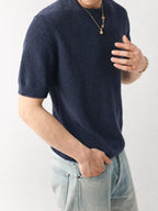 Mayfairloom Bruges Linen Knit Tee displayed on a hanger, showcasing its soft, textured linen knit fabric and relaxed fit.