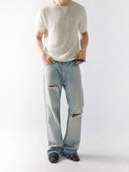 Mayfairloom Bruges Linen Knit Tee displayed on a hanger, showcasing its soft linen fabric and relaxed fit.