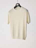 Mayfairloom Bruges Linen Knit Tee displayed on a hanger, featuring a soft, lightweight linen-knit fabric in a relaxed fit style.