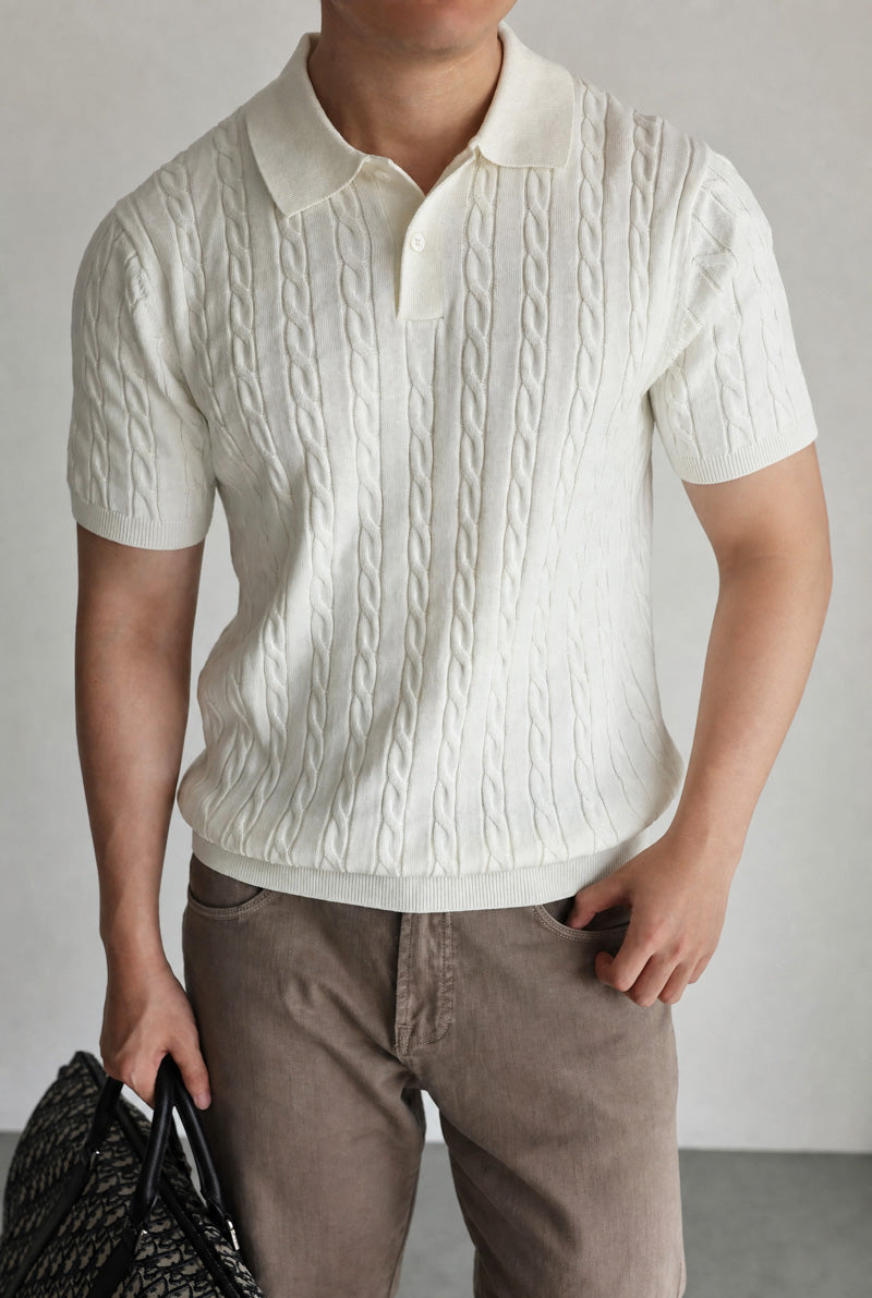 Mayfairloom Belmont Cable Polo shirt in navy, featuring cable knit design, collar, and button placket, displayed on a hanger.