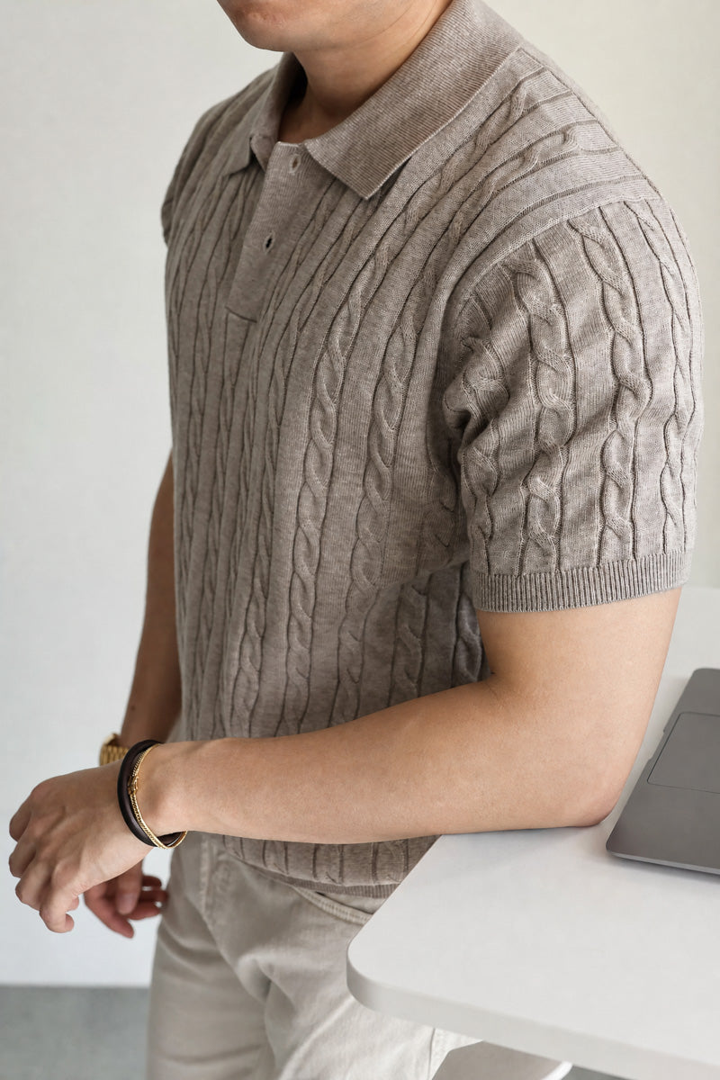 Mayfairloom Belmont Cable Polo shirt displayed on a hanger, featuring a classic collar and cable knit design.