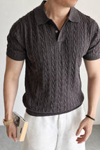 Mayfairloom Belmont Cable Polo shirt in navy with cable knit pattern, classic collar, and short sleeves displayed on a hanger.