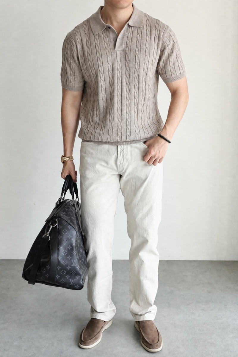 Mayfairloom Belmont Cable Polo shirt displayed on a hanger, featuring a classic cable-knit design and a collared neckline.