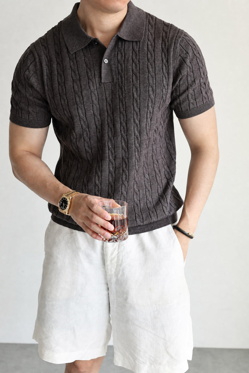 Mayfairloom Belmont Cable Polo shirt in navy, featuring cable knit pattern and classic collar, laid flat for display.