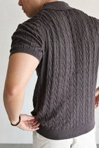 Mayfairloom Belmont Cable Polo shirt in navy, featuring a classic collar and cable knit pattern, displayed on a hanger.