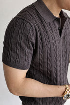 Mayfairloom Belmont Cable Polo shirt in navy with cable-knit design and classic collar, displayed on a hanger.