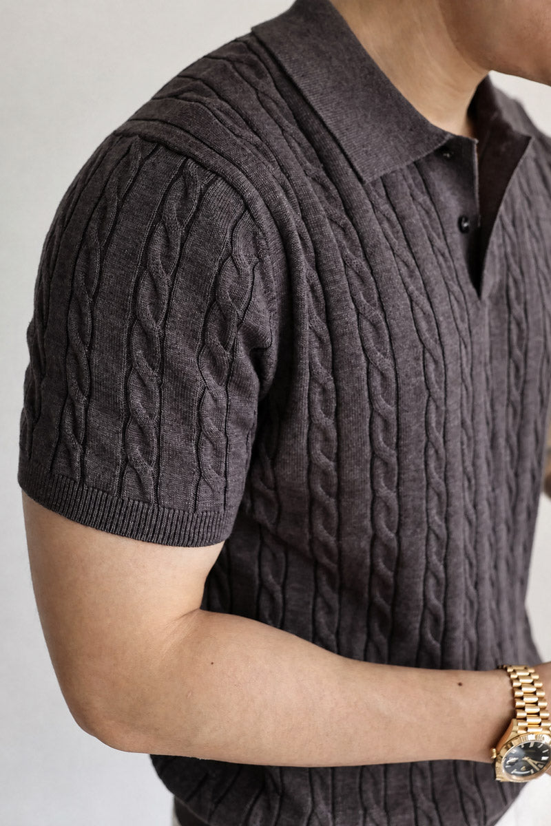 Mayfairloom Belmont Cable Polo shirt in navy with cable-knit design and classic collar, displayed on a hanger.