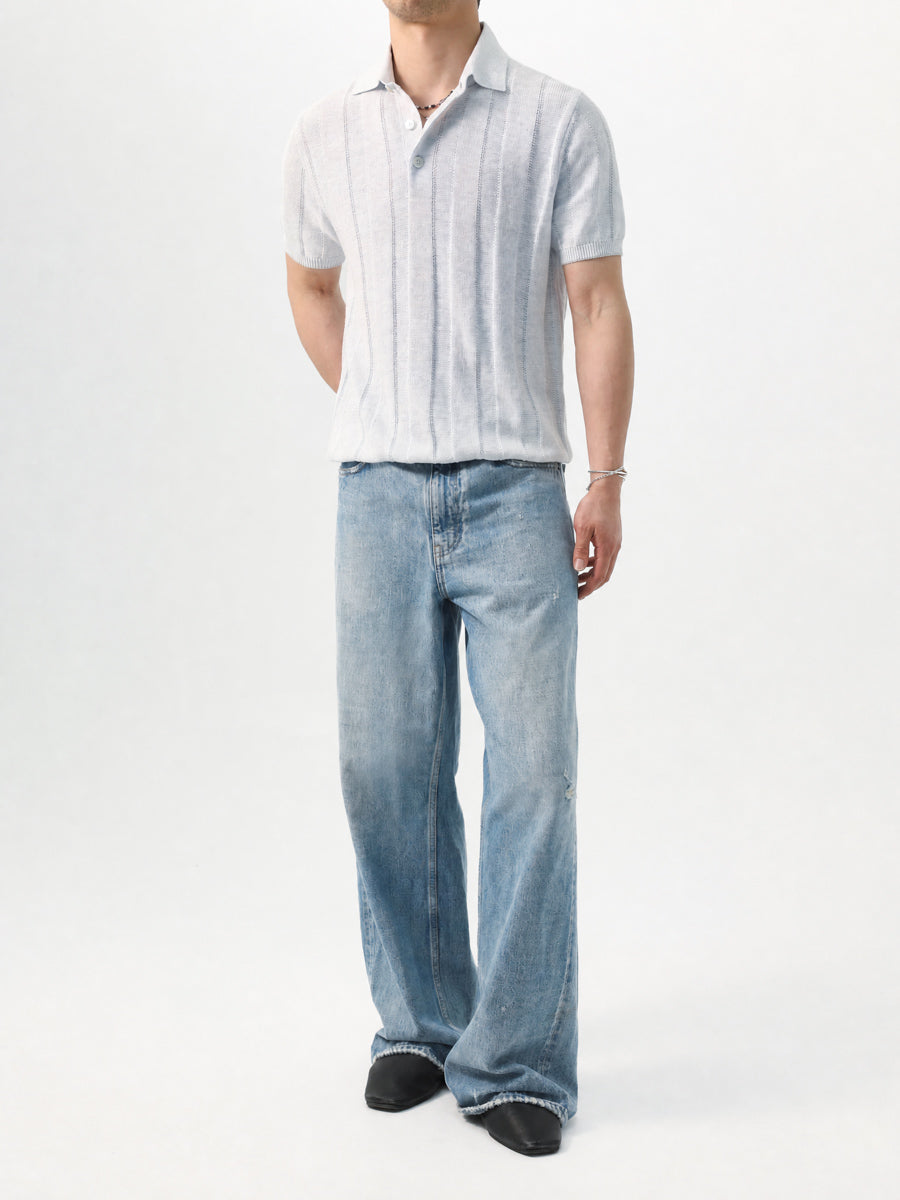 Mayfairloom Parthenon Hemp Knit Polo shirt displayed on a hanger, showcasing its textured hemp fabric and classic polo design.