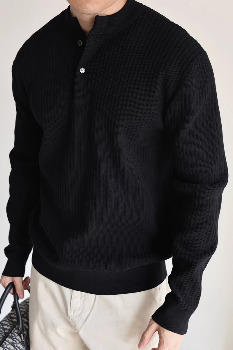 Mayfairloom double-twist cotton ribbed henley sweater displayed on a hanger, showcasing its textured fabric and classic design.