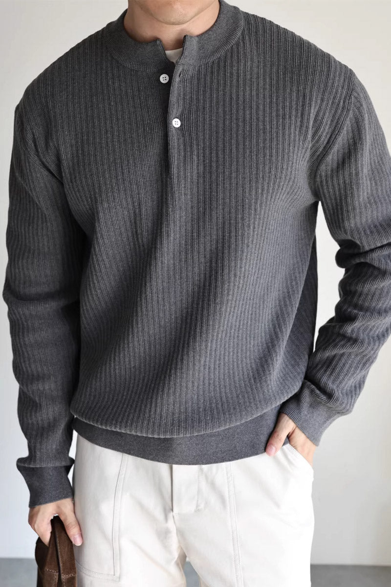 Mayfairloom double-twist cotton ribbed henley sweater displayed on a hanger, showcasing its textured fabric and classic henley collar.