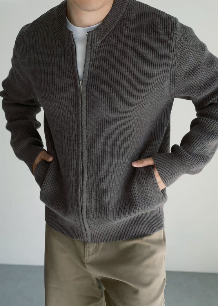 Close-up of the Olive Grey fisherman rib knit, showcasing the dense combed-cotton texture and premium finish